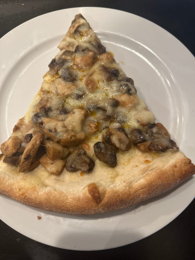 Chicken Marsala Pizza Slice.