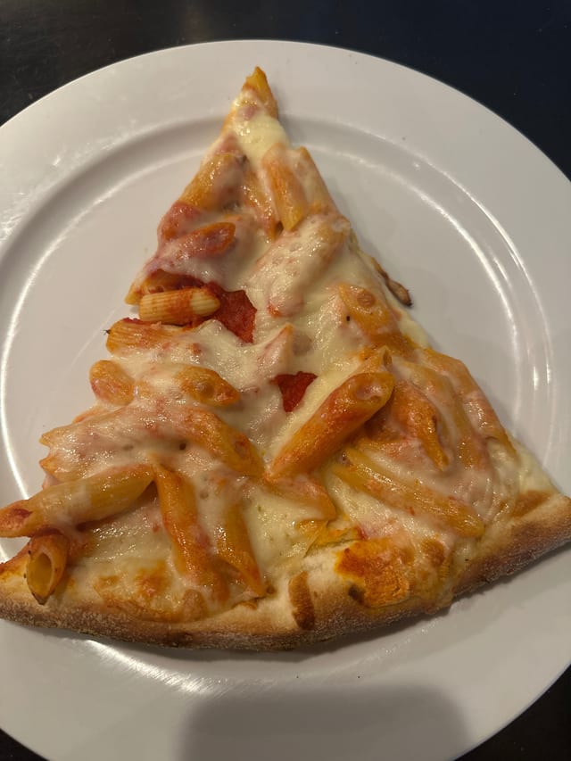 Baked Ziti Pizza Slice.